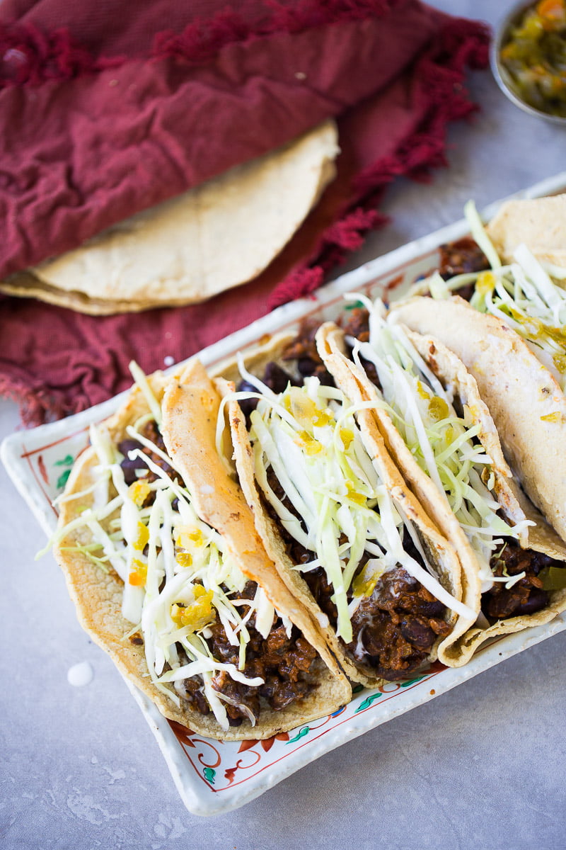 Vegan Mexican tacos recipe with corn tortillas and black beans with chorizo.