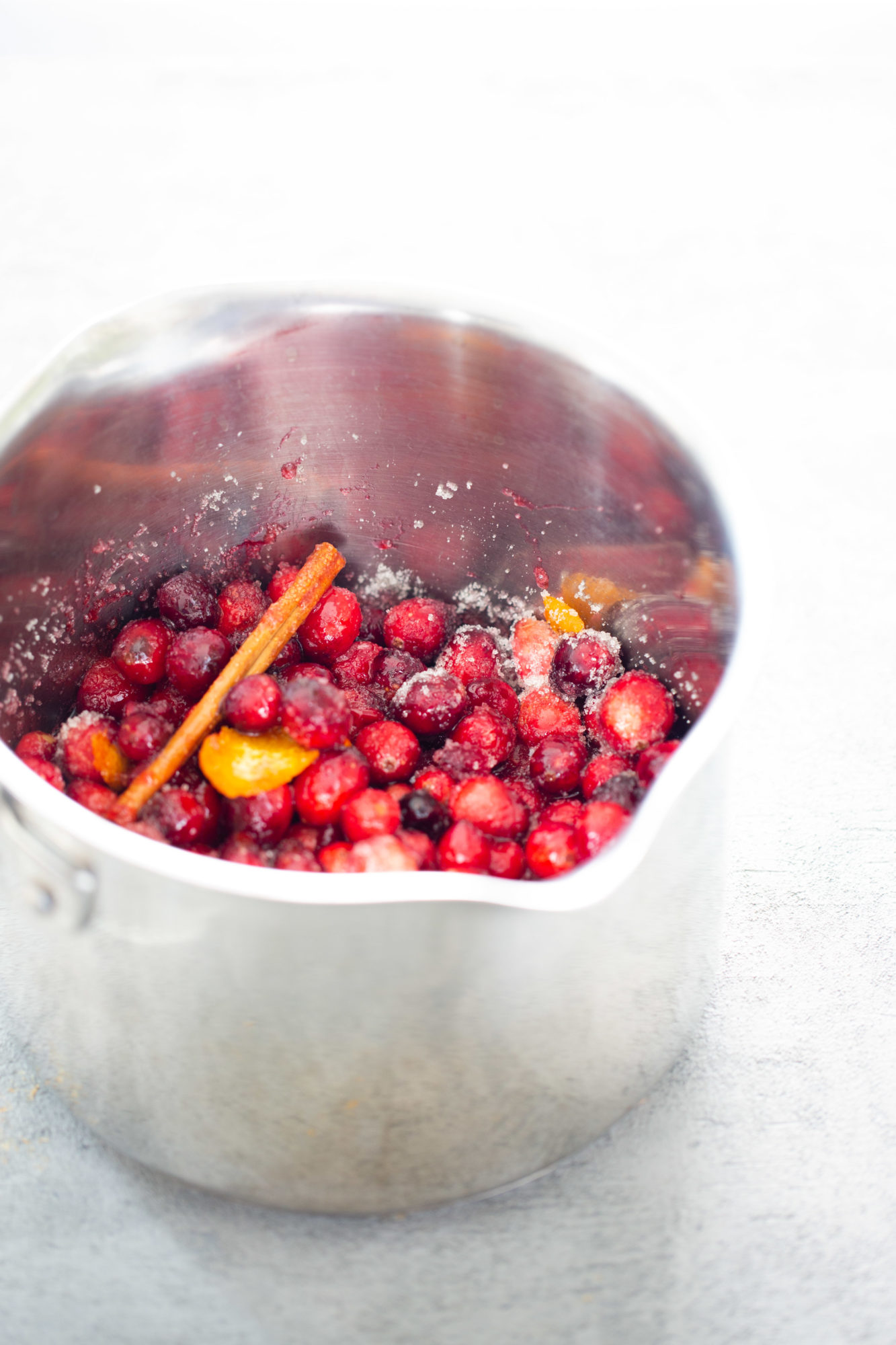 cranberries in a pot to make cranberry sauce