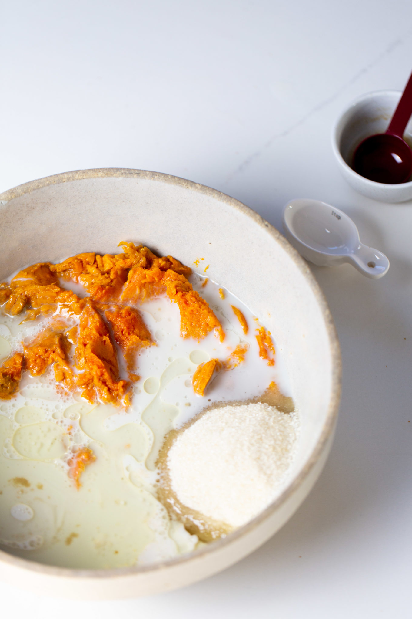 ingredients in a bowl to make sweet potato doughnuts