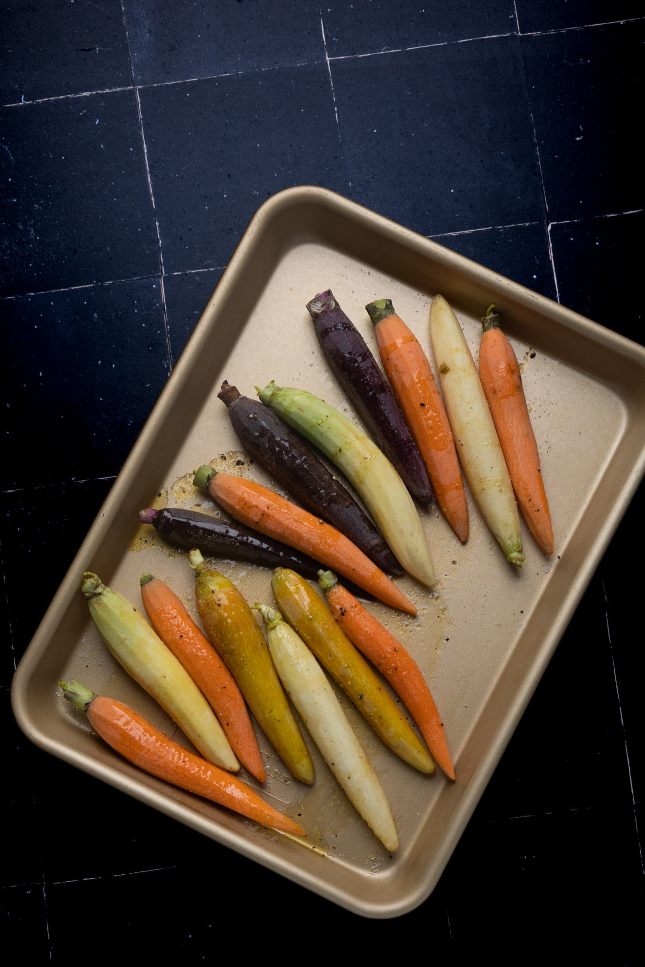 Roasted carrots on a baking sheet.